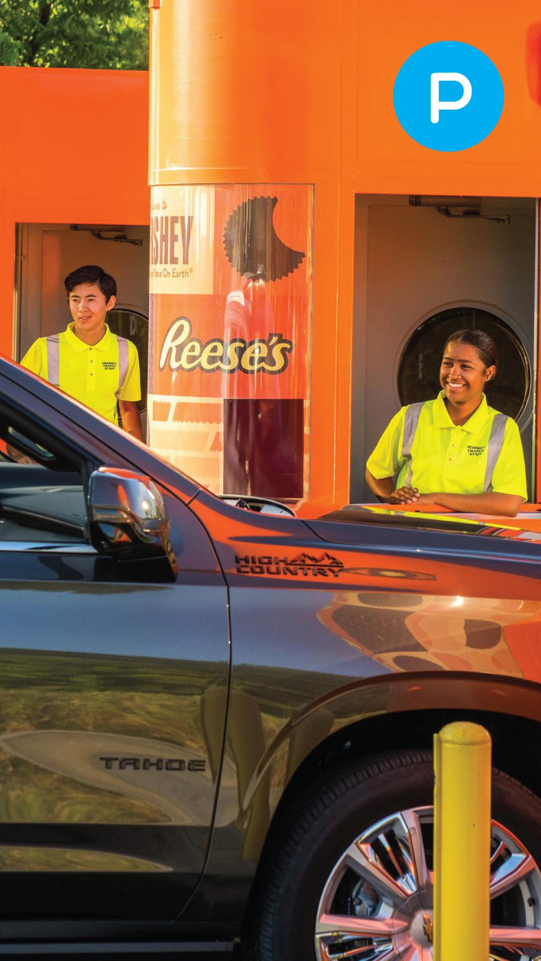 employee-leaning-out-of-parking-booth-smiling.jpg
