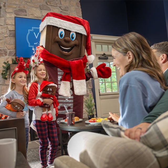 sisters-with-hershey-bar-character-at-hershey-resort.jpg