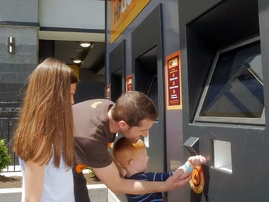 boy-scanning-wristband-at-hpgo-kiosk.jpg