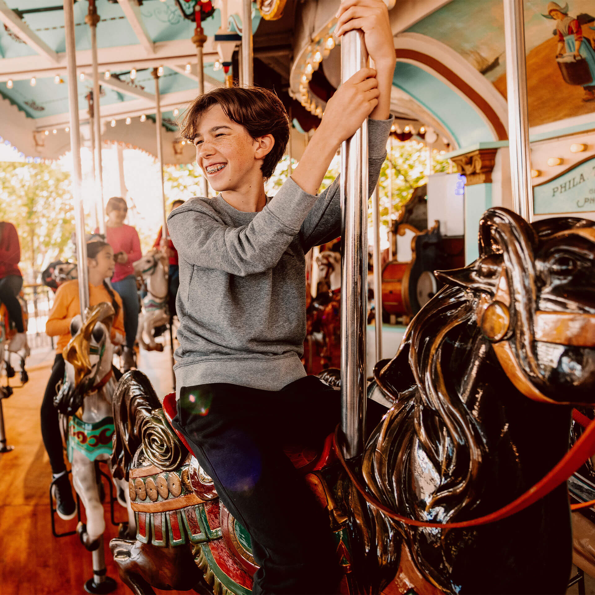 smiling-kid-riding-carousel-at-hersheypark-footer.jpg