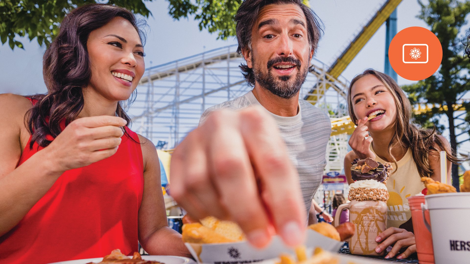 family-eating-in-front-of-coment-and-skyrush.jpg