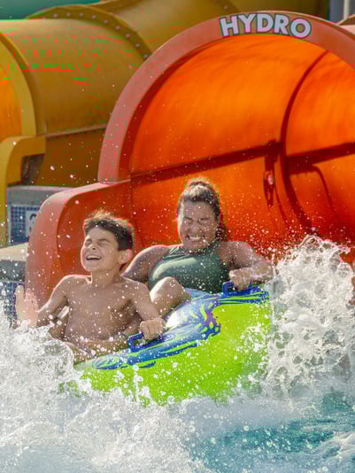 Mother-and-Son-exiting-coastline-plunge-water-slide.jpg