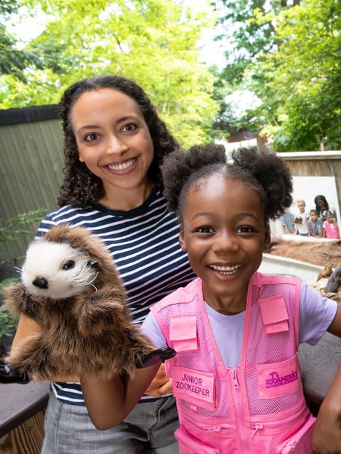 mother-and-daughter-posing-with-otter-puppet.jpg