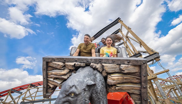 father-and-teen-laughing-while-riding-wildcats-revenge.jpg