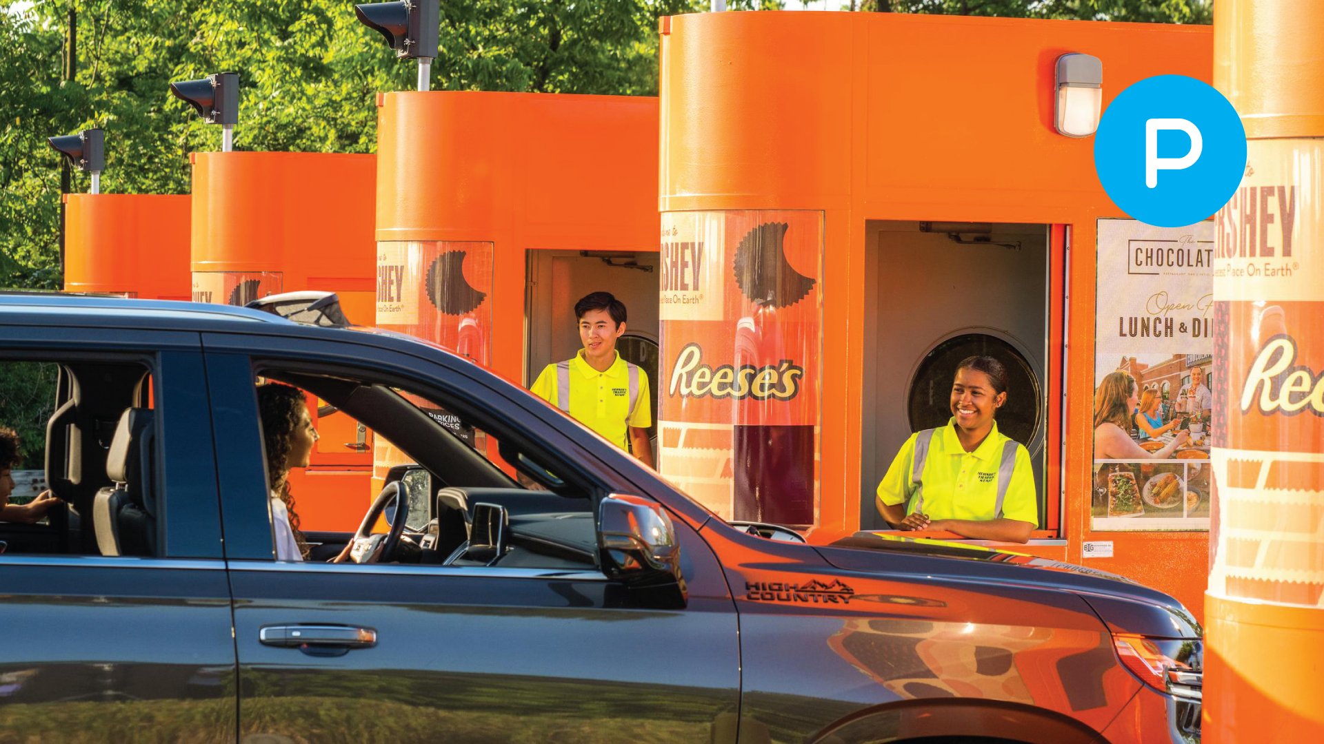 guest-driving-through-parking-booth-with-parking-icon.jpg