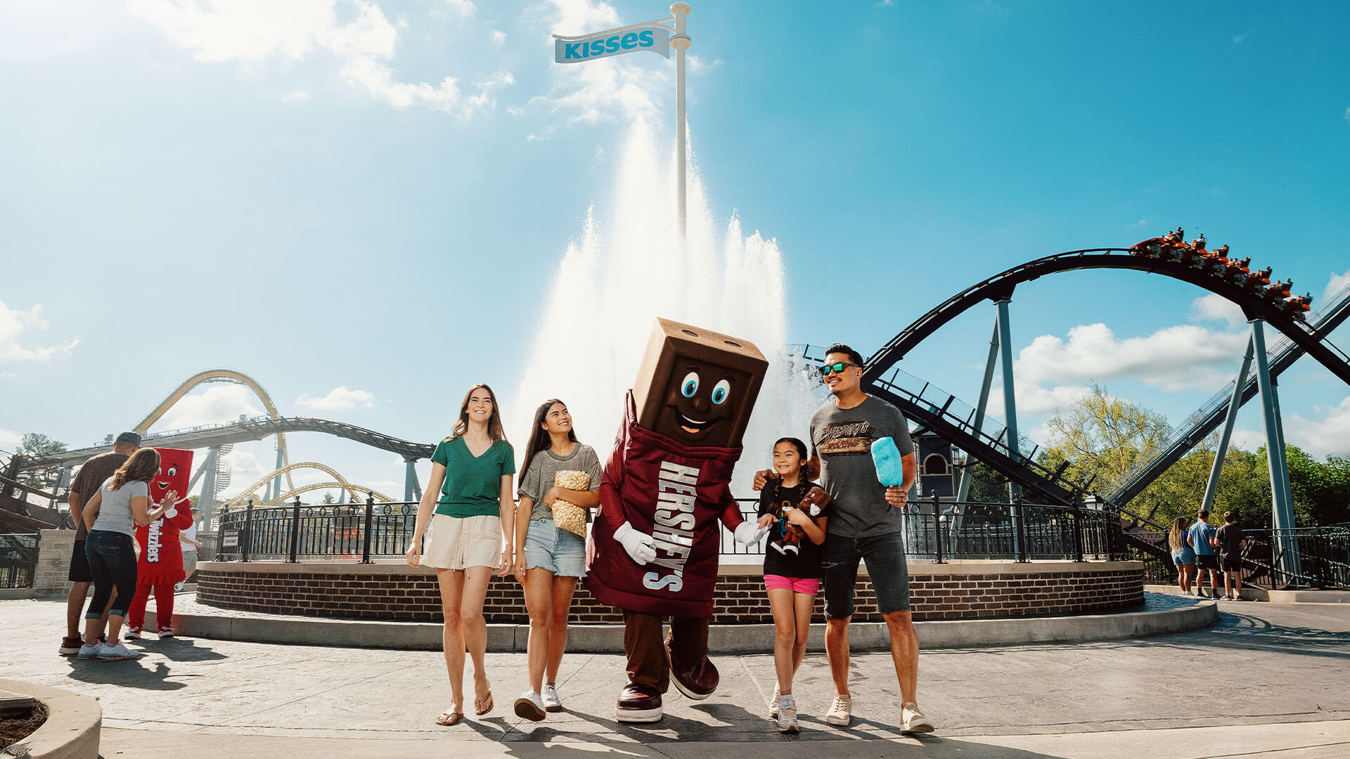 family-with-hershey-bar-character-kissing-fountain.jpg