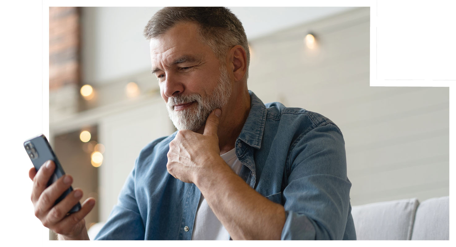 man looking at smart phone