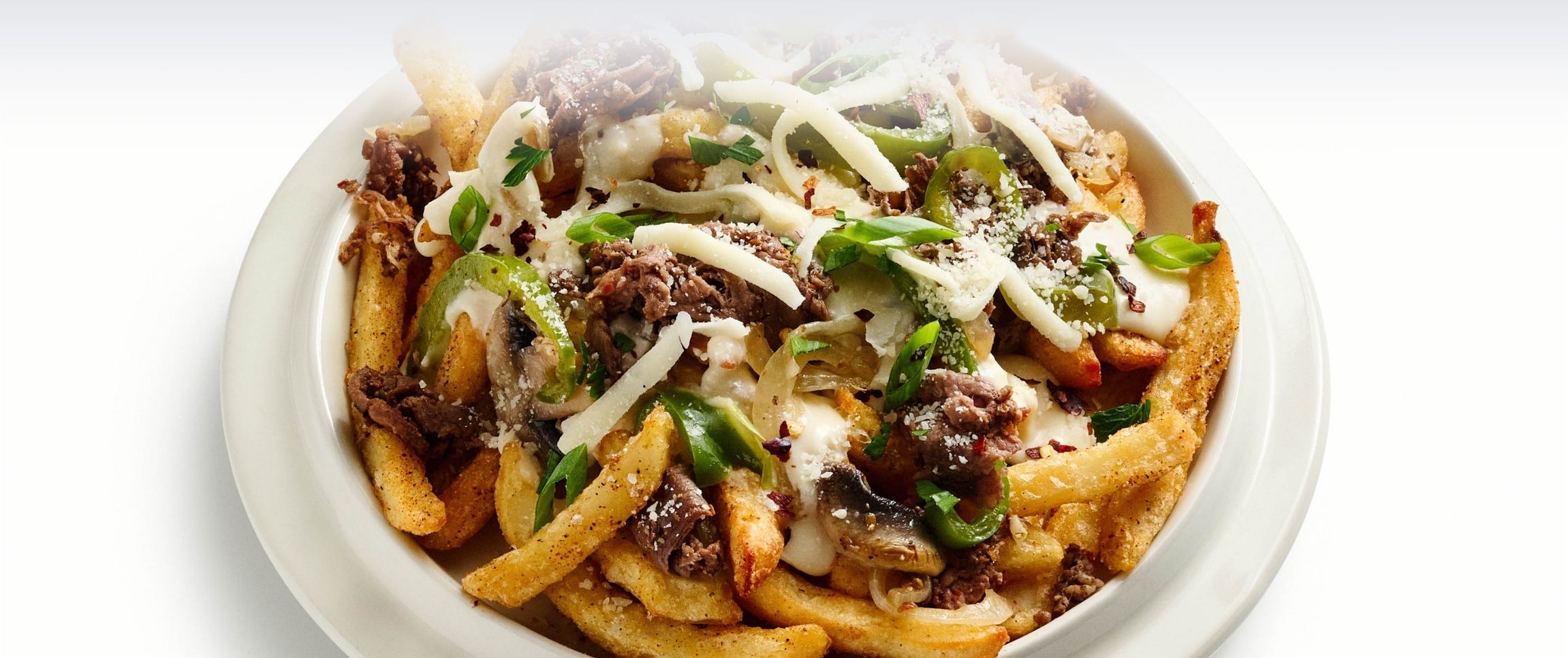 Hero - Full Width/performancefoodservice-DISHRecipes-Cheesesteak_Loaded_Fries-HeroFull