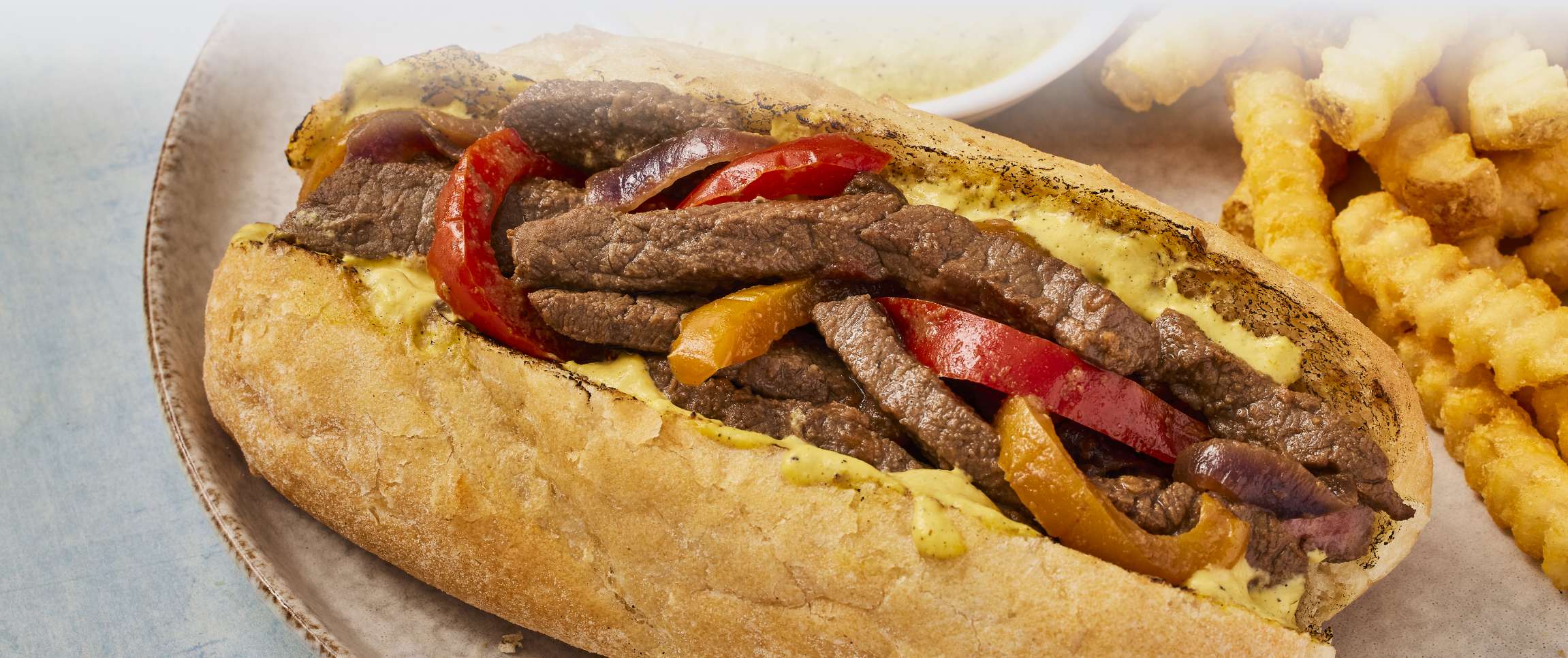 Hero - Full Width/Performancefoodservice-Recipes-Lomo_Saltado_Steak_Sandwich-herofull