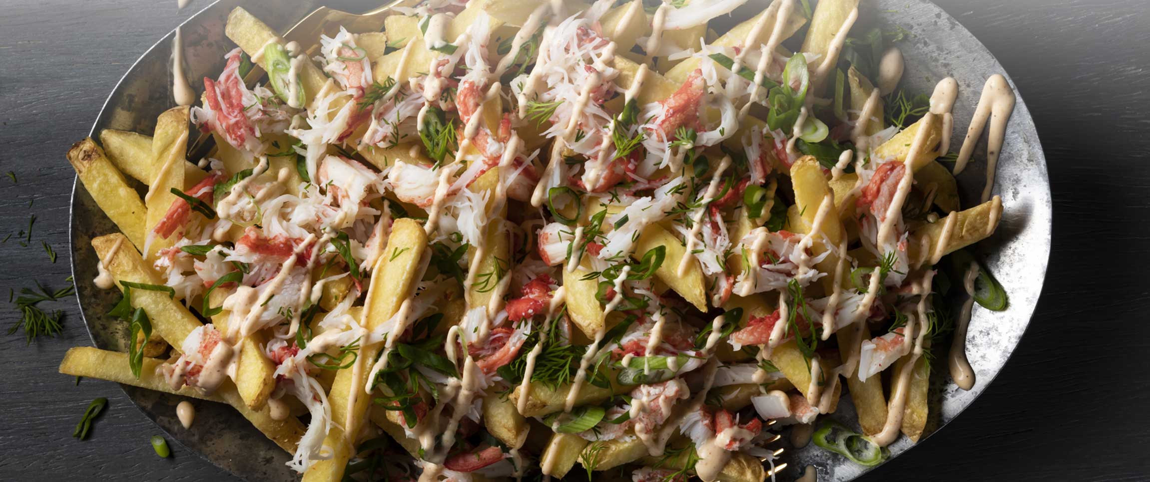 Hero - Full Width/performancefoodservice-Recipes-LoadedFriesWithCrab-HeroFull