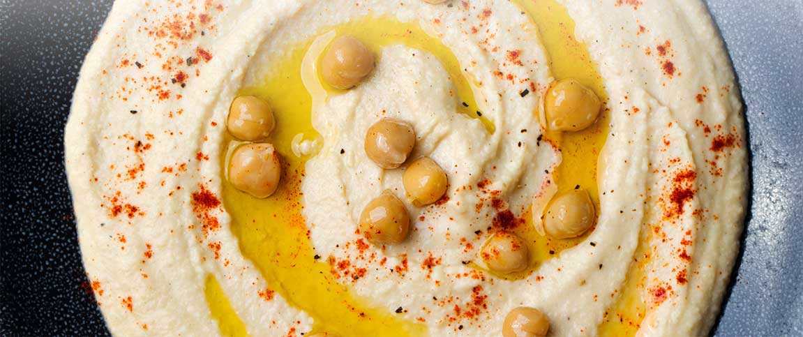 Hero - Full Width/performancefoodservice-Recipes-TRADITIONAL_HUMMUS_GARNISH-heroHalf