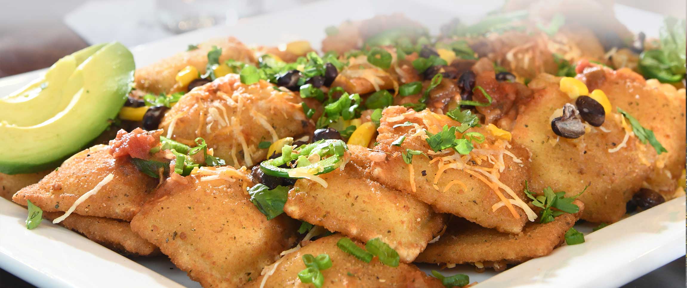 Hero - Full Width/Performancefoodservice-recipe-fourcheeseraviolinachos-herofull