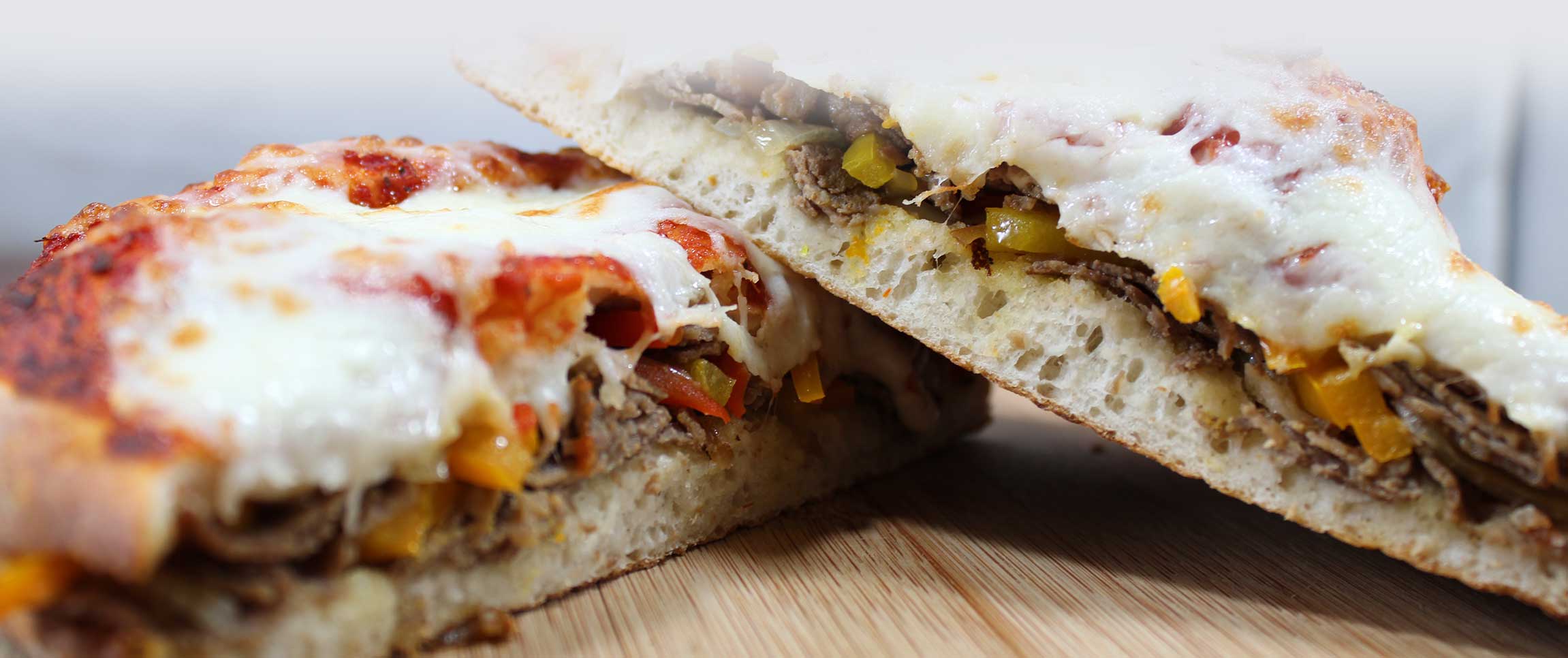 Hero - Full Width/performancefoodservice-recipes-RomaSteakStuffedPizza-herofull