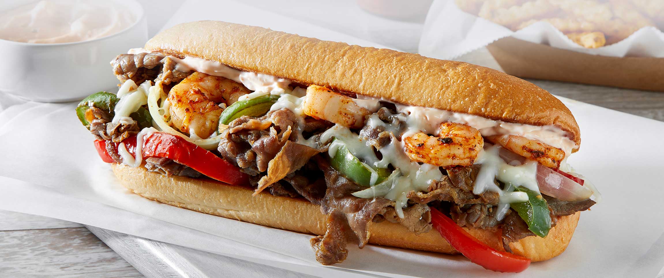 Hero - Full Width/performancefoodservieDishRecipesSurfTurfPhillyHeroFull