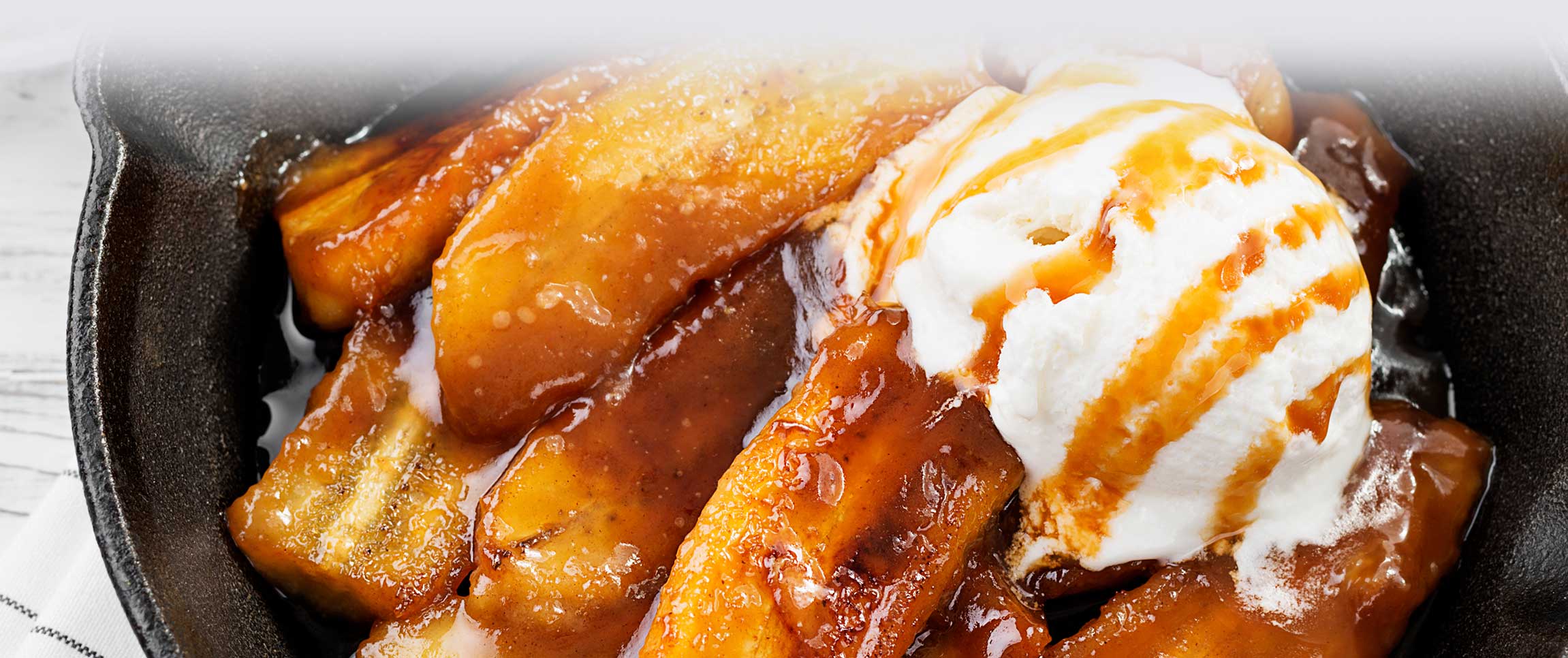 Hero - Full Width/performancefoodservice-recipes-BananasFosterWithVanillaIcecream-herofull
