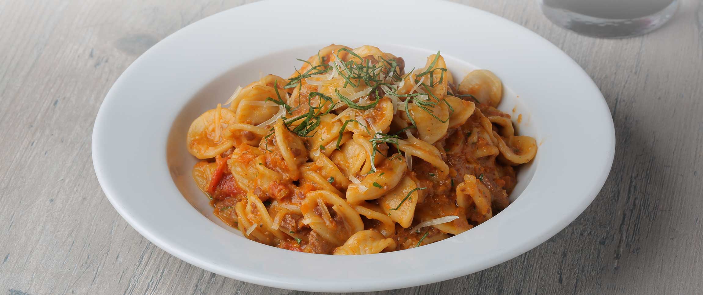 Hero - Full Width/performancefoodservice-Recipes-RomaSausageOrecchietteBolognese-HeroFull