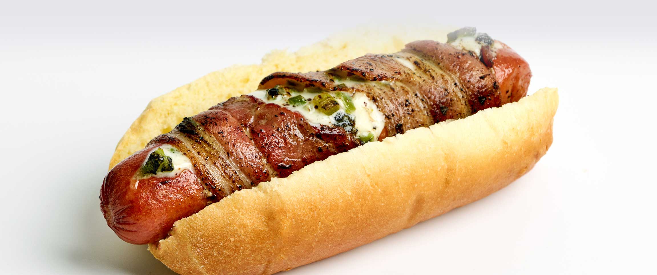 Hero - Full Width/performancefoodservice-DISHRecipes-BaconWrappedHotdog-herofull