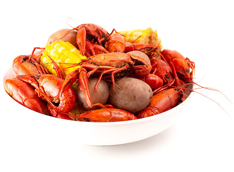Bowl of crawfish, potatoes, and corn.