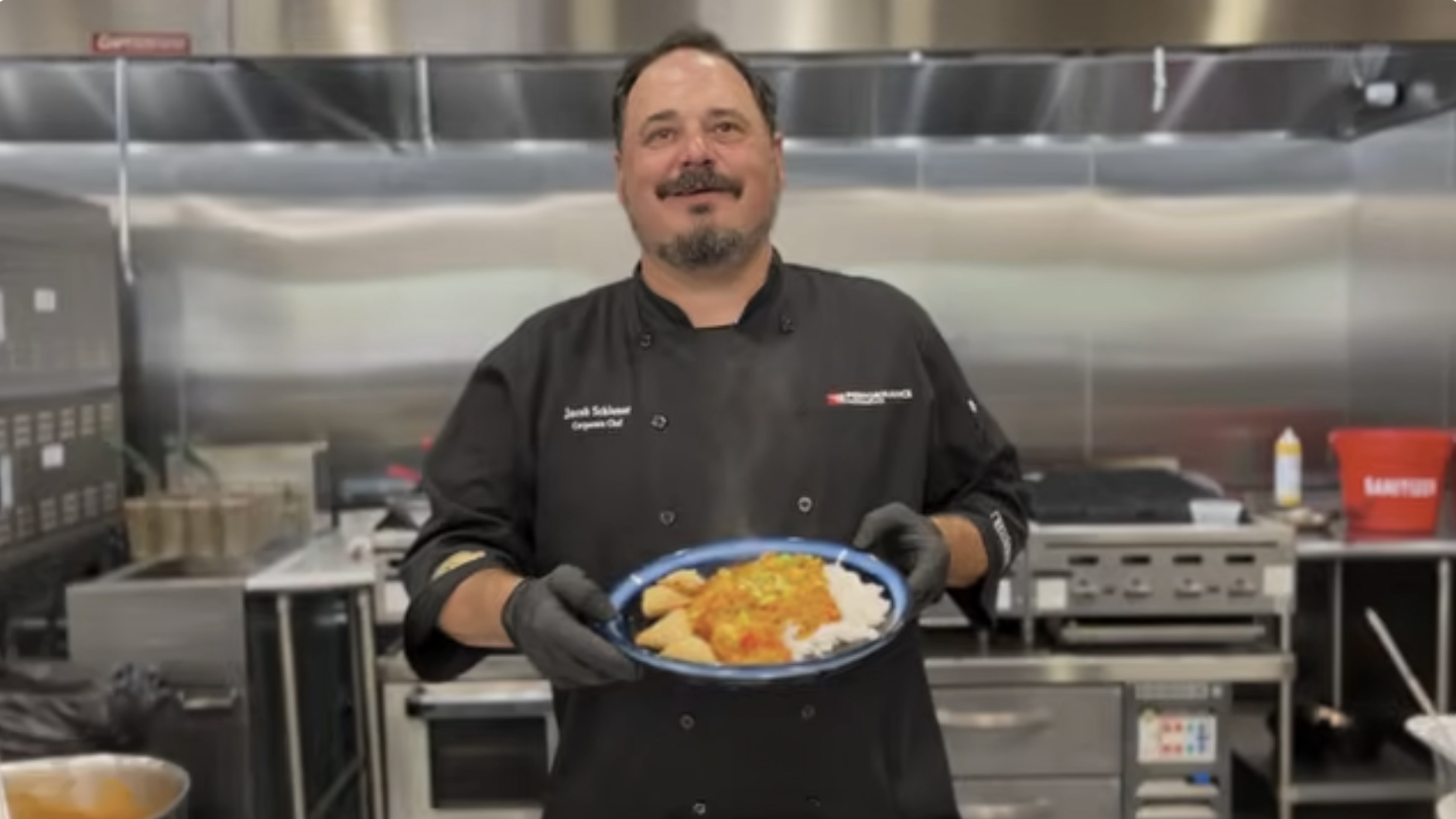 Chef holding Vegetarian Tikka Masala